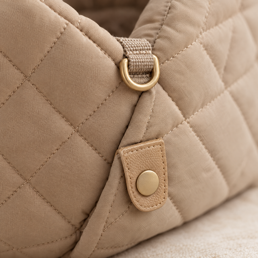 Close-up of the snap tab and gold D-ring
